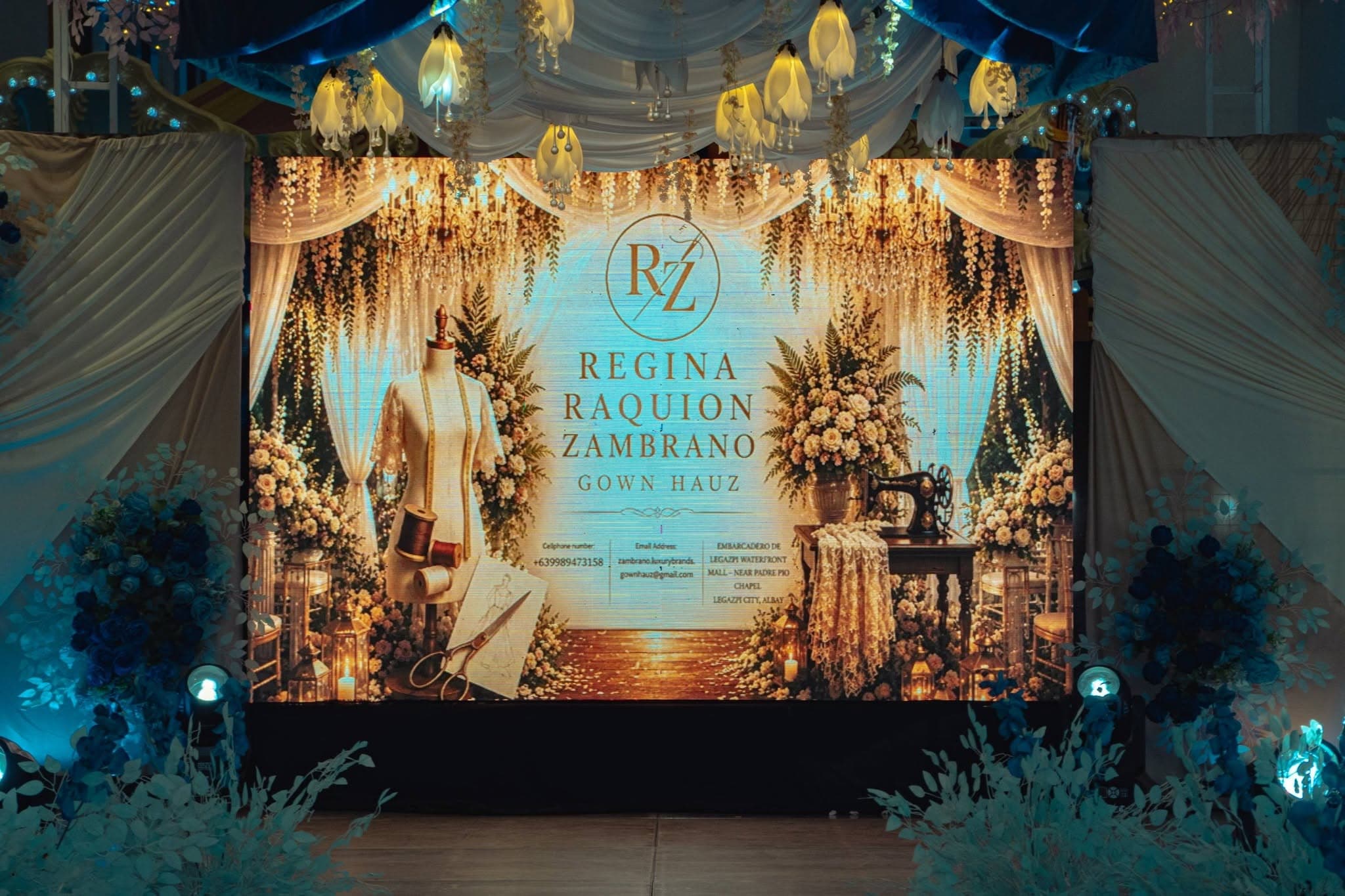 Elegant event staging with floral design and LED backdrop